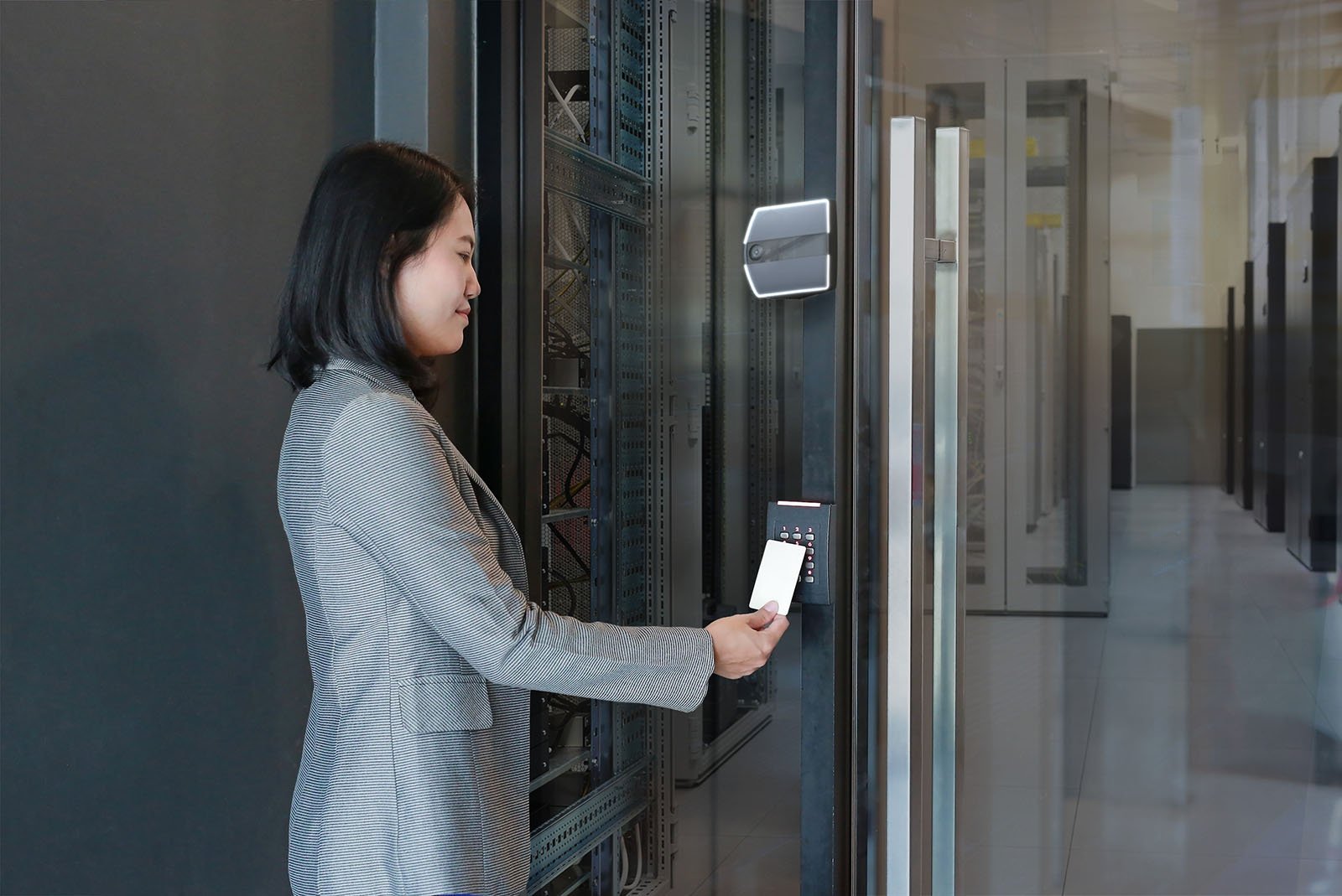 Woman using access control in a building