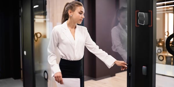 Woman in white accessing office with Rock 600x300