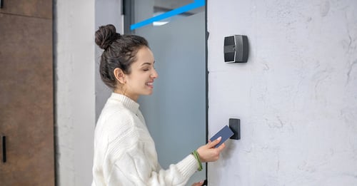 Woman using access card and Rock for 2FA